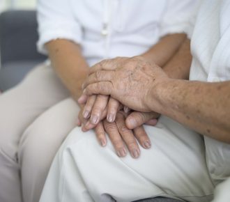 vecteezy_close-up-of-elderly-hands-holding-each-other-grandfather_5131047-min