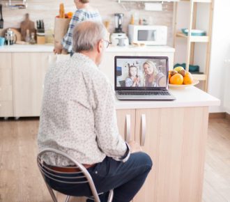 vecteezy_senior-man-talking-with-niece-on-video-call_4623194-min